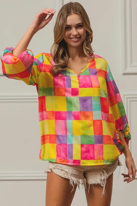 Pink, yellow, and blue BiBi Multi Block Bubble Pop Balloon Top by Trendsi, featuring colorful block design and playful fabric details.