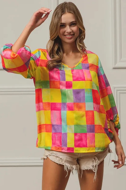 Pink, yellow, and blue BiBi Multi Block Bubble Pop Balloon Top by Trendsi, featuring colorful block design and playful fabric details.