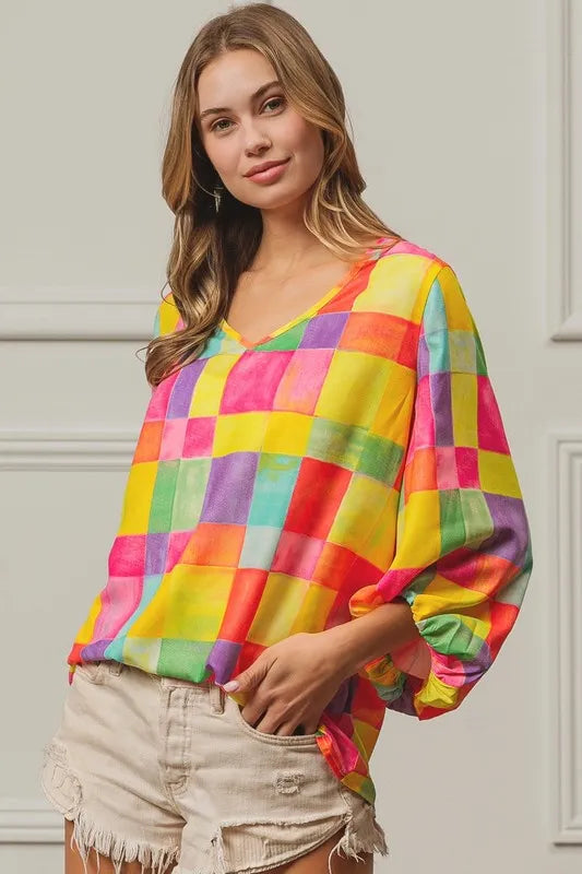 Pink, yellow, and blue BiBi Multi Block Bubble Pop Balloon Top from Trendsi, featuring colorful bubble designs and casual fit.