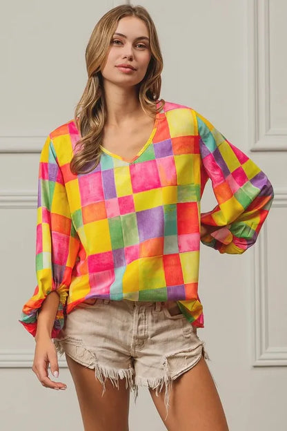 Pink, yellow, and blue BiBi Multi Block Bubble Pop Balloon Top by Trendsi, featuring colorful bubble designs and a relaxed fit.