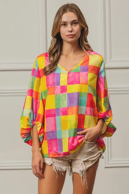 Pink, yellow, and blue BiBi Multi Block Bubble Pop Balloon Top by Trendsi, featuring colorful bubble designs and a casual fit.