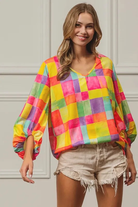 Pink, yellow, and blue BiBi Multi Block Bubble Pop Balloon Top by Trendsi, featuring colorful bubble pattern and casual fit.