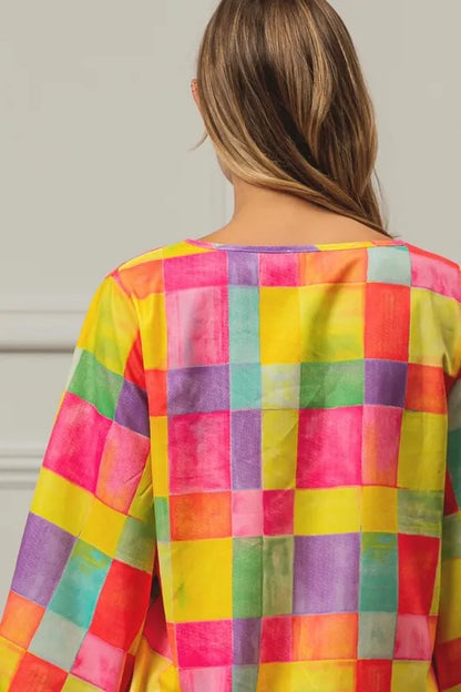 Pink, yellow, and blue BiBi Multi Block Bubble Pop Balloon Top by Trendsi, featuring colorful bubble pattern and casual fit.