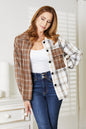 Trendi double take plaid contrast button-up shirt jacket featuring a classic plaid pattern and button details.