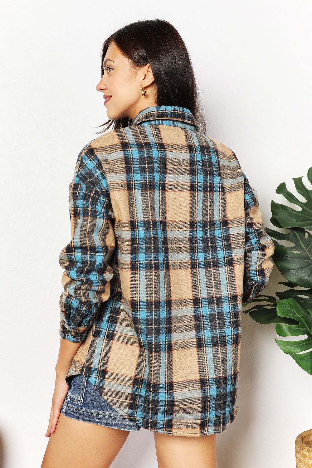 Trendsi Double Take plaid shirt jacket with curved hem and breast pockets, featuring a stylish casual design.