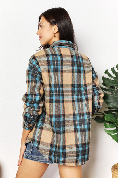 Trendsi Double Take plaid shirt jacket with curved hem and breast pockets, featuring a stylish casual design.