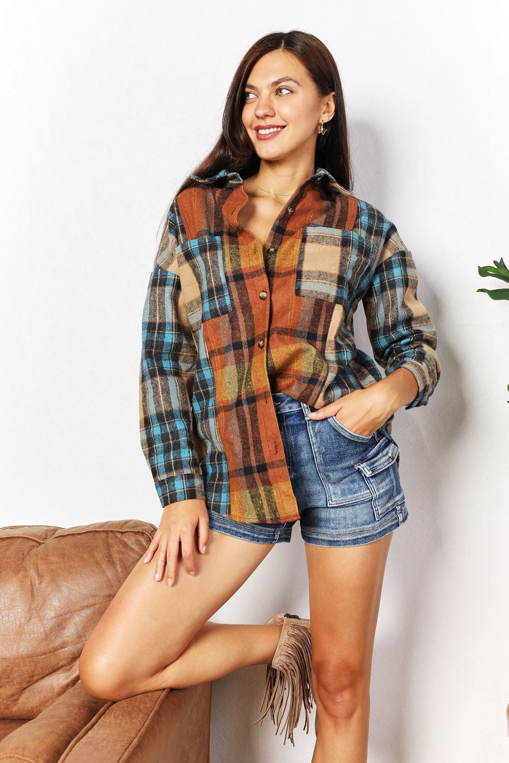 Trendsi Double Take plaid shirt jacket with curved hem, breast pockets, in a classic plaid pattern, casual and stylish for layered outfits.
