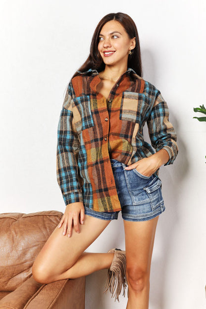 Trendsi Double Take plaid shirt jacket with curved hem, breast pockets, in a classic plaid pattern, casual and stylish for layered outfits.