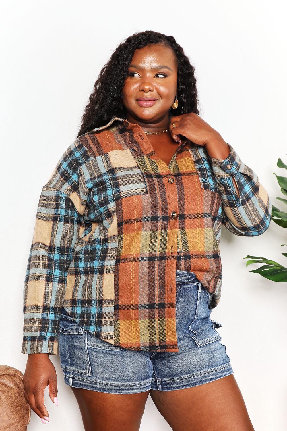 Trendsi Double Take plaid shirt jacket with curved hem, breast pockets, long sleeves, and button-up front.