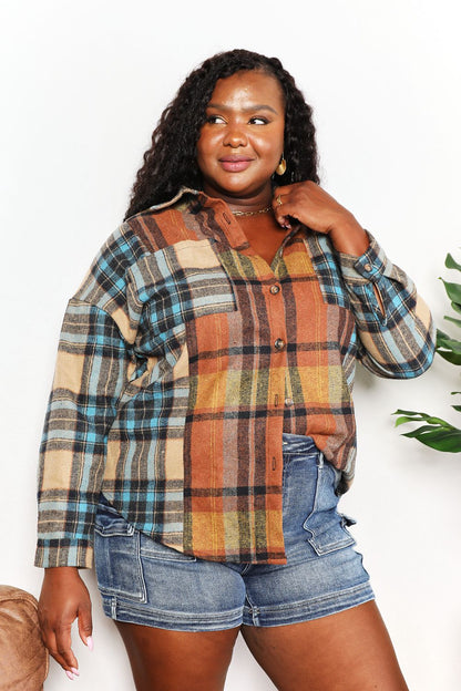 Trendsi Double Take plaid shirt jacket with curved hem, breast pockets, long sleeves, and button-up front.