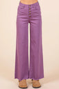 Plum-colored Mittoshop twill high-waisted wide-leg pants with button fly and relaxed fit, styled for casual or chic looks.