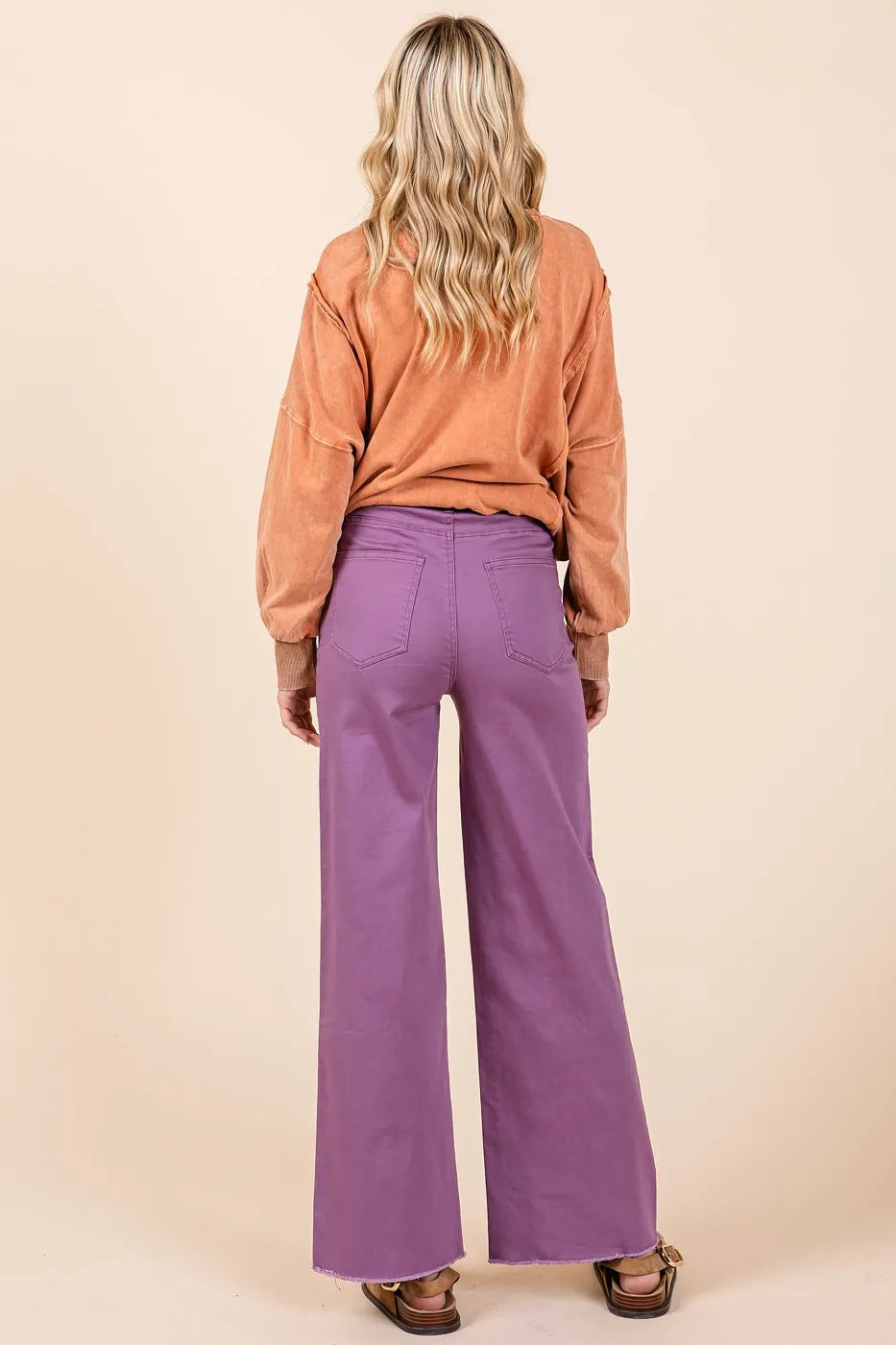 Plum Mittoshop high-waisted twill wide-leg pants with button fly and relaxed fit, styled for a trendy, casual look.
