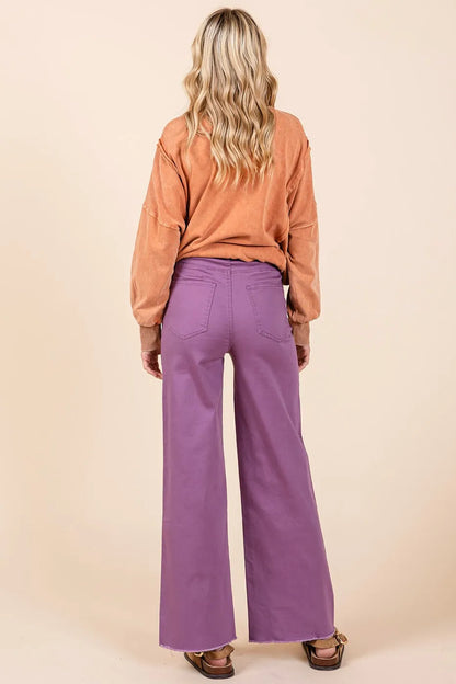 Plum Mittoshop high-waisted twill wide-leg pants with button fly and relaxed fit, styled for a trendy, casual look.