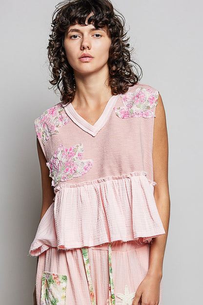 Powder pink sleeveless top with floral patch, ruffled details, and raw edge trim, by Trendsi.
