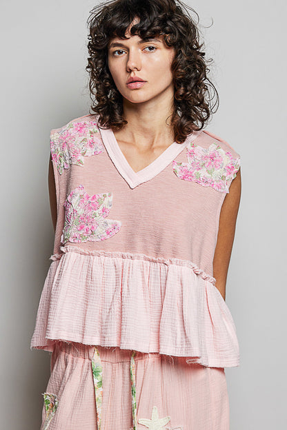 Powder pink floral patch ruffled sleeveless top with raw edge detail from Trendsi, showcasing a feminine and casual style.