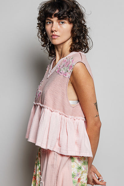 Powder pink sleeveless top with floral patch, ruffled design, and raw edge detail by Trendsi.
