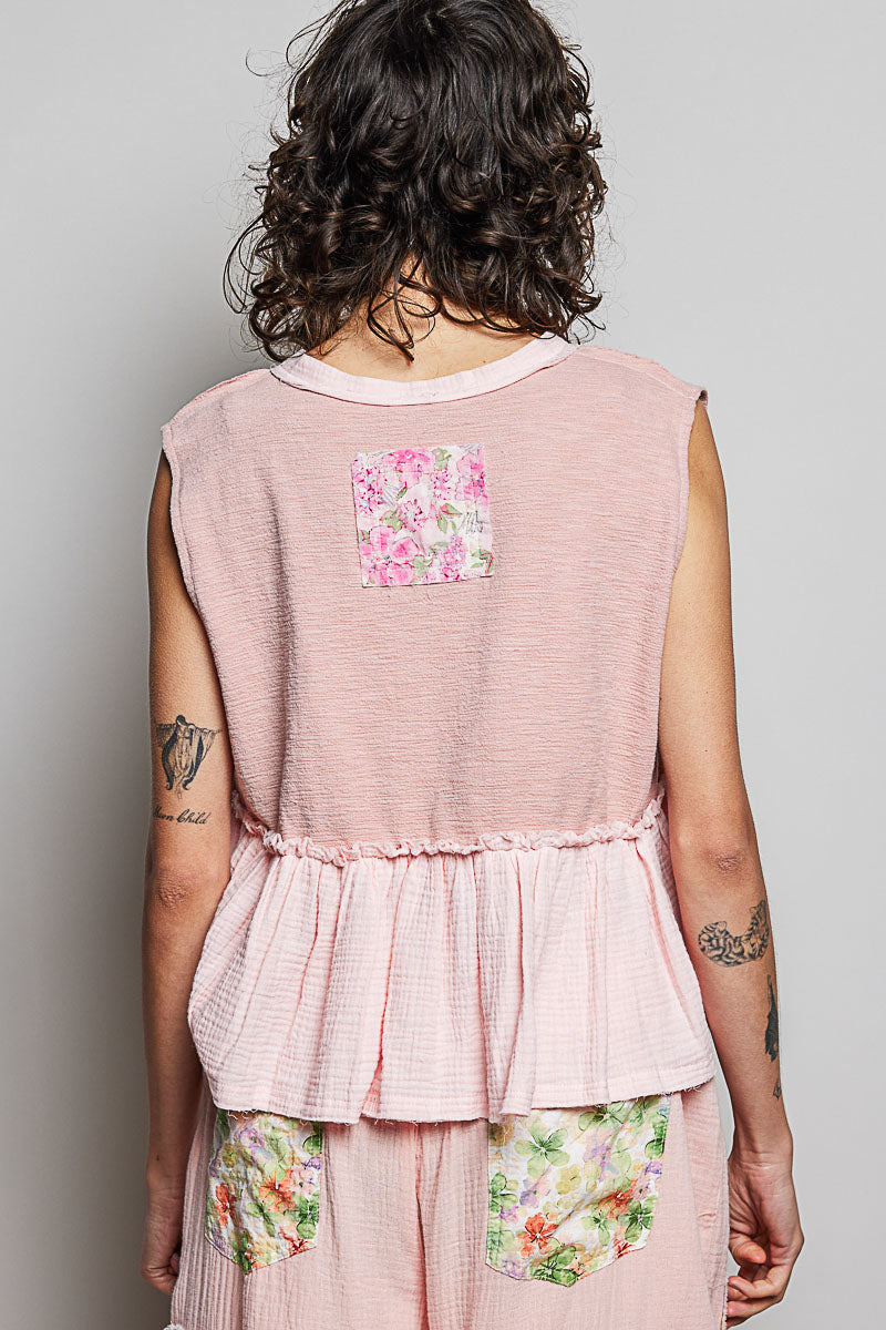 Powder pink floral patch ruffled sleeveless top with raw edge detail, showcasing trendy women's fashion by Trendsi.