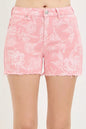 Risen high-rise printed shorts from Trendsi with colorful floral pattern and fitted waist, styled for casual summer wear.