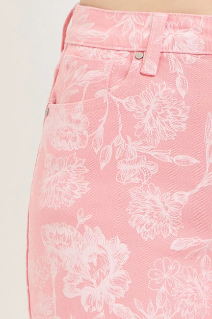 Risen high-rise printed shorts from Trendsi featuring colorful floral pattern and casual fit on a model.