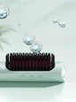 Purple portable heated straightening comb by Trendsi, compact design for easy hair styling and straightening.