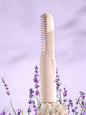 Purple Trendsi portable heated straightening comb with ergonomic handle, designed for easy hair styling on the go.