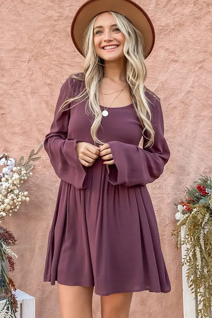 Purple bell sleeve dress with lace back detail and button-down front from Trendsi, styled with a casual yet elegant look.