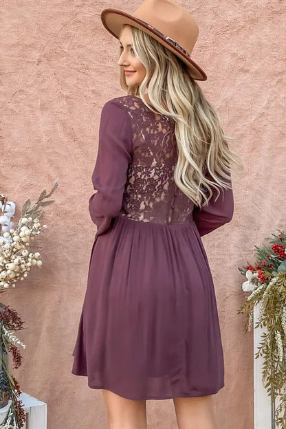 Purple bell sleeve dress from Trendsi featuring lace back, button-down front, and stylish details, perfect for elegant occasions.