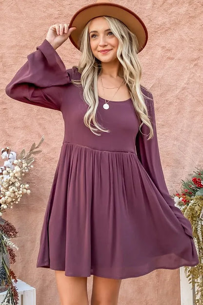 Purple bell sleeve dress with lace back and button-down detail by Trendsi, featuring stylish long bell sleeves and elegant design.