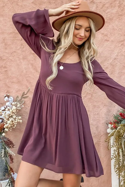 Purple bell sleeve dress with lace back and button-down detail by Trendsi, featuring a stylish and elegant design.