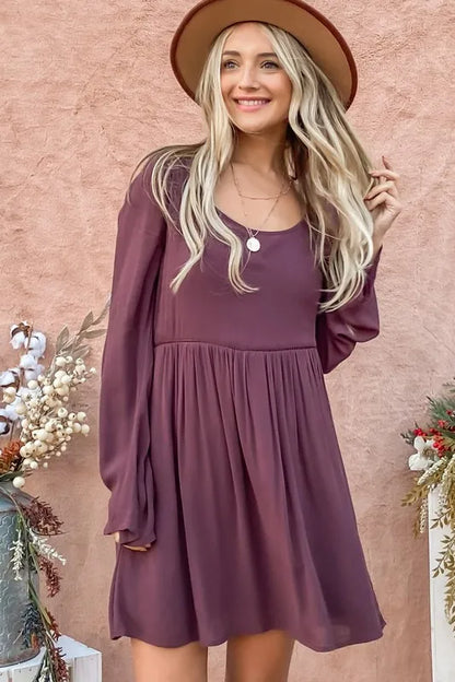 Purple bell sleeve dress with lace back and button-down detail by Trendsi, featuring a stylish and elegant design.