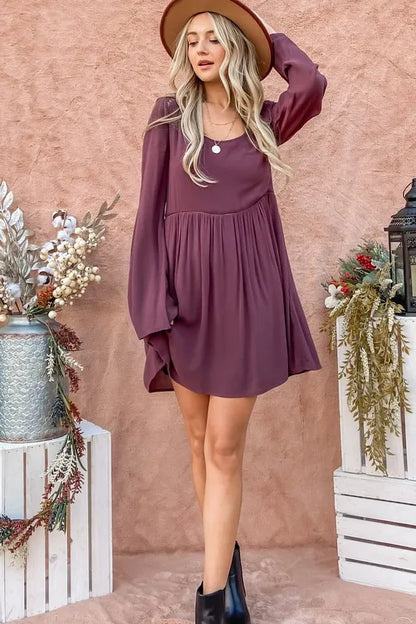 Purple bell sleeve dress with lace-back detail and button-down front by Trendsi, featuring stylish long sleeves and elegant design.