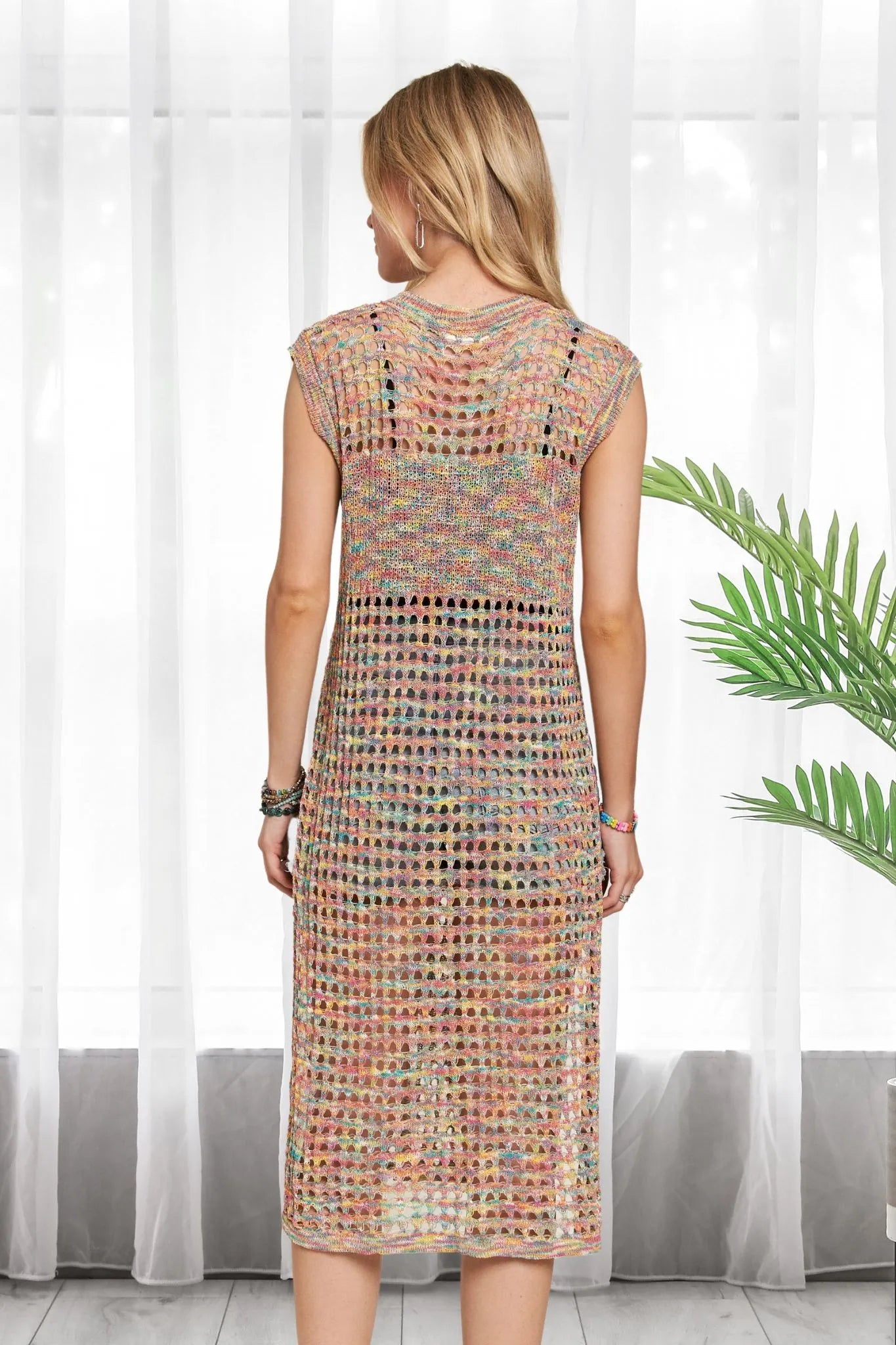 Multi-color crochet tunic top by ADORA, featuring vibrant rainbow hues and intricate crochet details, stylish and comfortable.