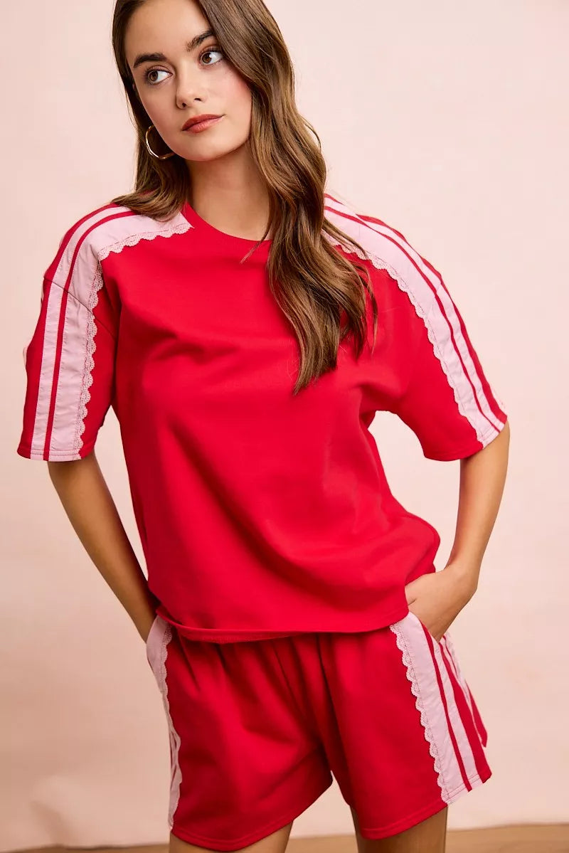 Red blush BiBi French Terry short sleeve top with side lace detail from Trendsi.