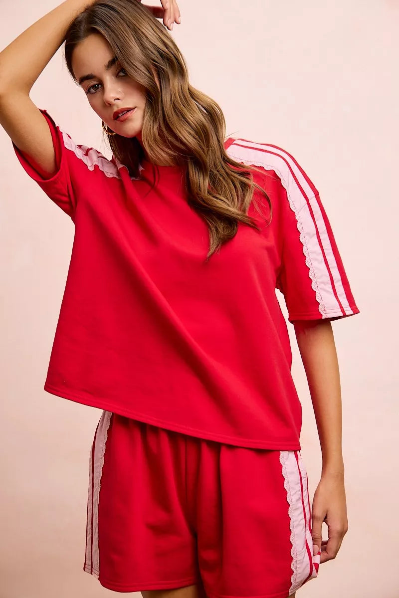 Red blush BiBi French Terry top with short sleeves and side lace detail, by Trendsi, shown on a model.