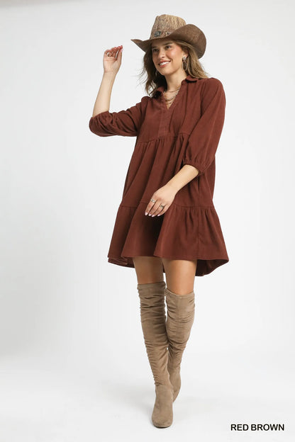 Red-brown Umgee tiered corduroy mini dress with balloon sleeves, featuring a stylish, textured design and a flattering fit.