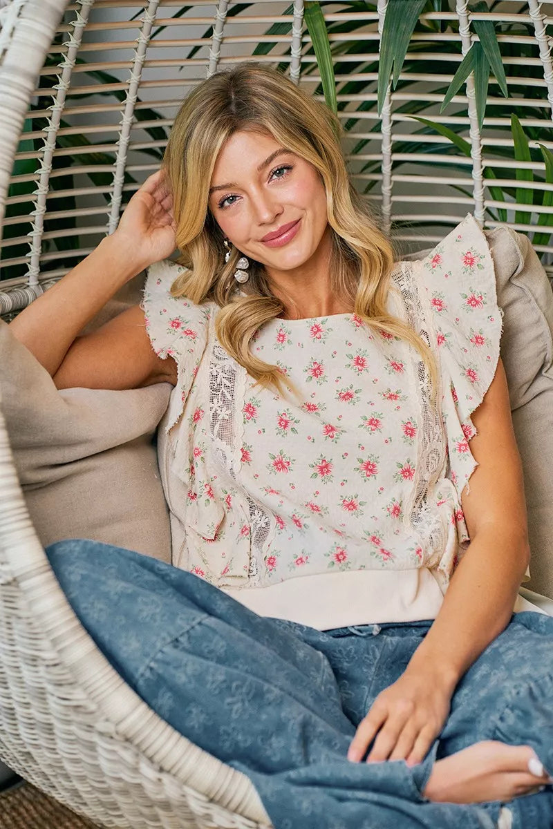 Red floral printed top with ruffle sleeves and trim detail from Trendsi, featuring a stylish and feminine design.