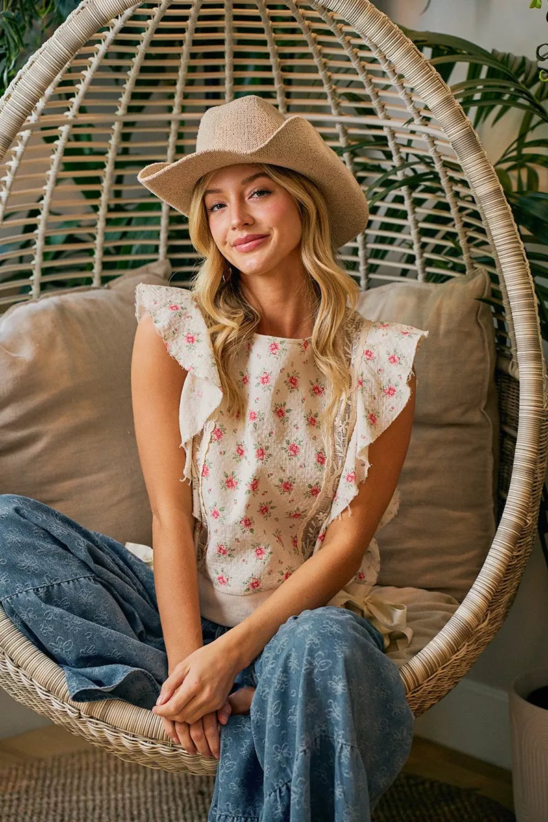 Red floral printed top with ruffle sleeves and trim detail from Trendsi, showcasing a stylish, feminine blouse design.