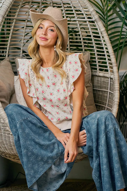 Red floral printed top with ruffle sleeves and trim detail, trendy blouse from Trendsi featuring feminine design.