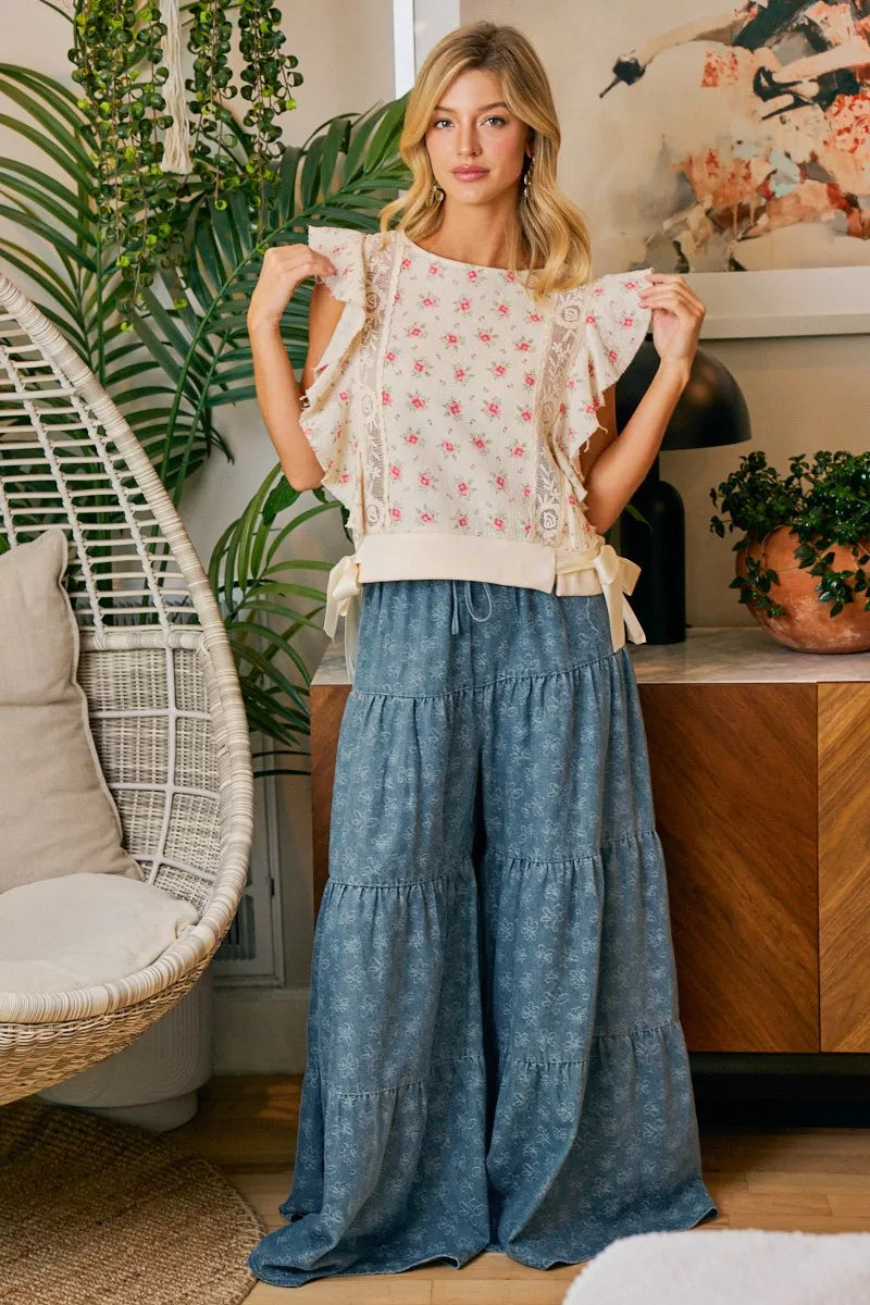 Red floral printed top with ruffle sleeves and trim detail, stylish blouse by Trendsi featuring a feminine design.
