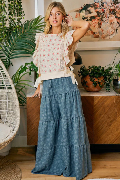 Red BiBi floral printed top by Trendsi featuring ruffle sleeves and trim detail, stylish and feminine blouse.