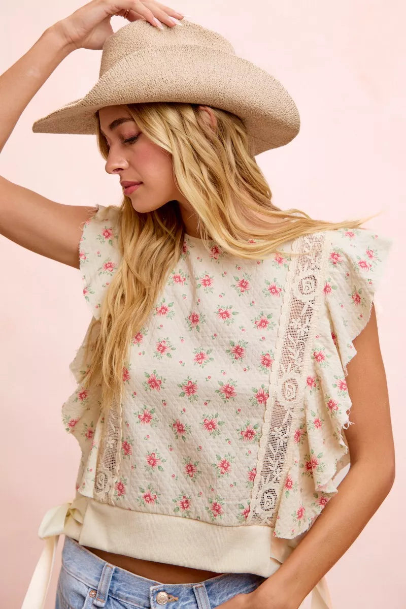Red BiBi flower printed top with ruffle sleeves and trim detail from Trendsi, featuring a floral pattern and stylish design.