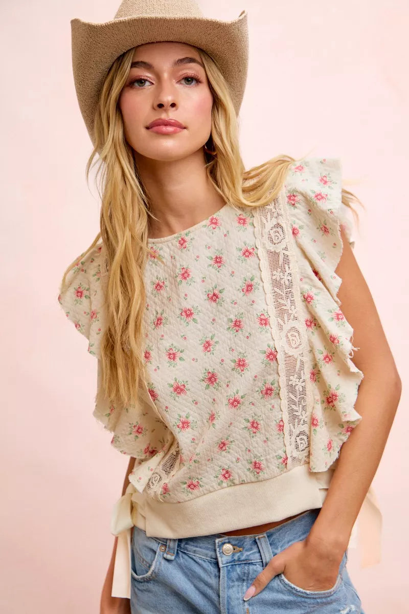 Red floral printed top with ruffle sleeves and trim detail from Trendsi, showcasing a stylish and feminine blouse design.
