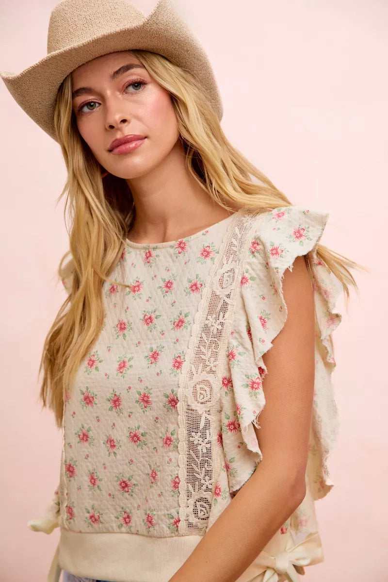 Red floral printed top by Trendsi with ruffle sleeves and trim detail, featuring a feminine, flowy design.