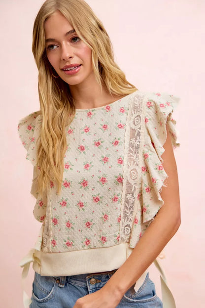 Red floral printed top with ruffle sleeves and trim detail, trendy blouse by Trendsi featuring a feminine design.