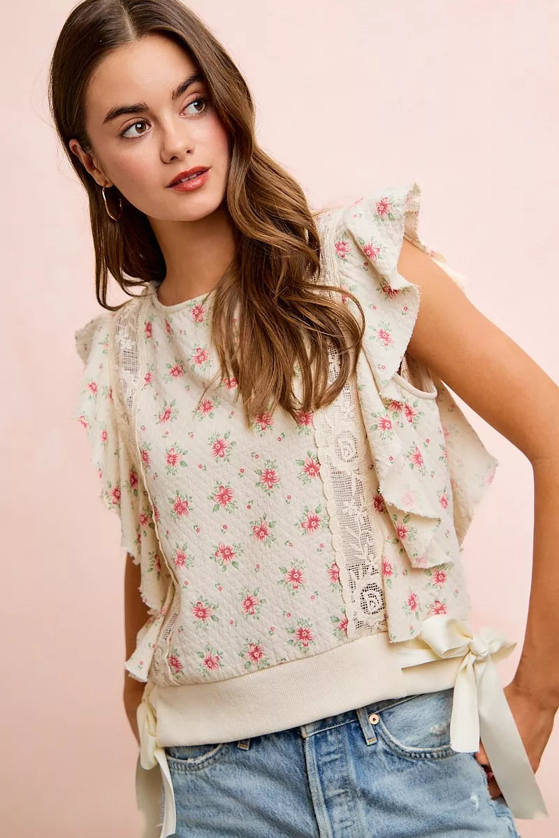 Red floral printed ruffle sleeve top with trim detail from Trendsi featuring a feminine and stylish design.