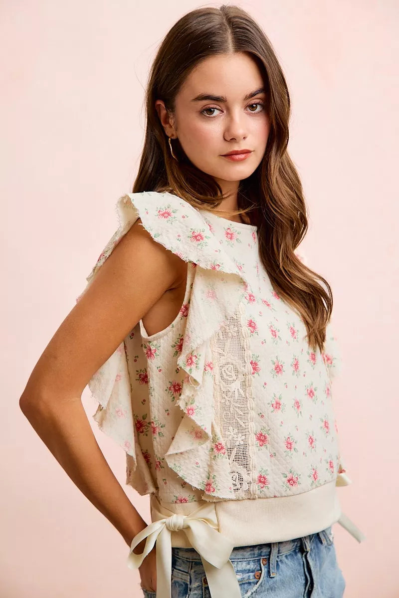 Red floral printed top with ruffle sleeves and trim detail from Trendsi, showcasing a stylish and feminine design.
