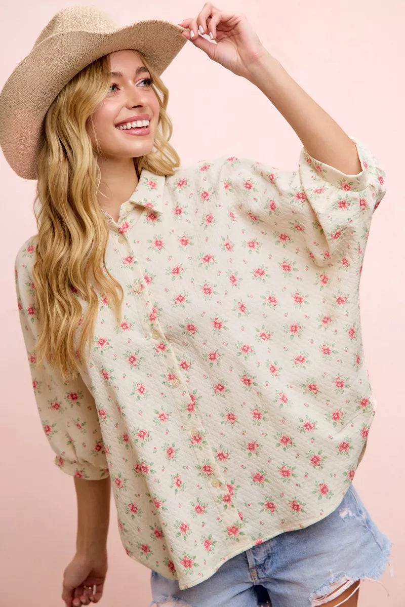 Red floral printed short dolman blouse top by Trendsi featuring a relaxed fit and feminine flower design.