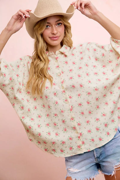 Red flower printed BiBi short dolman blouse top by Trendsi, featuring a relaxed fit and vibrant floral design.