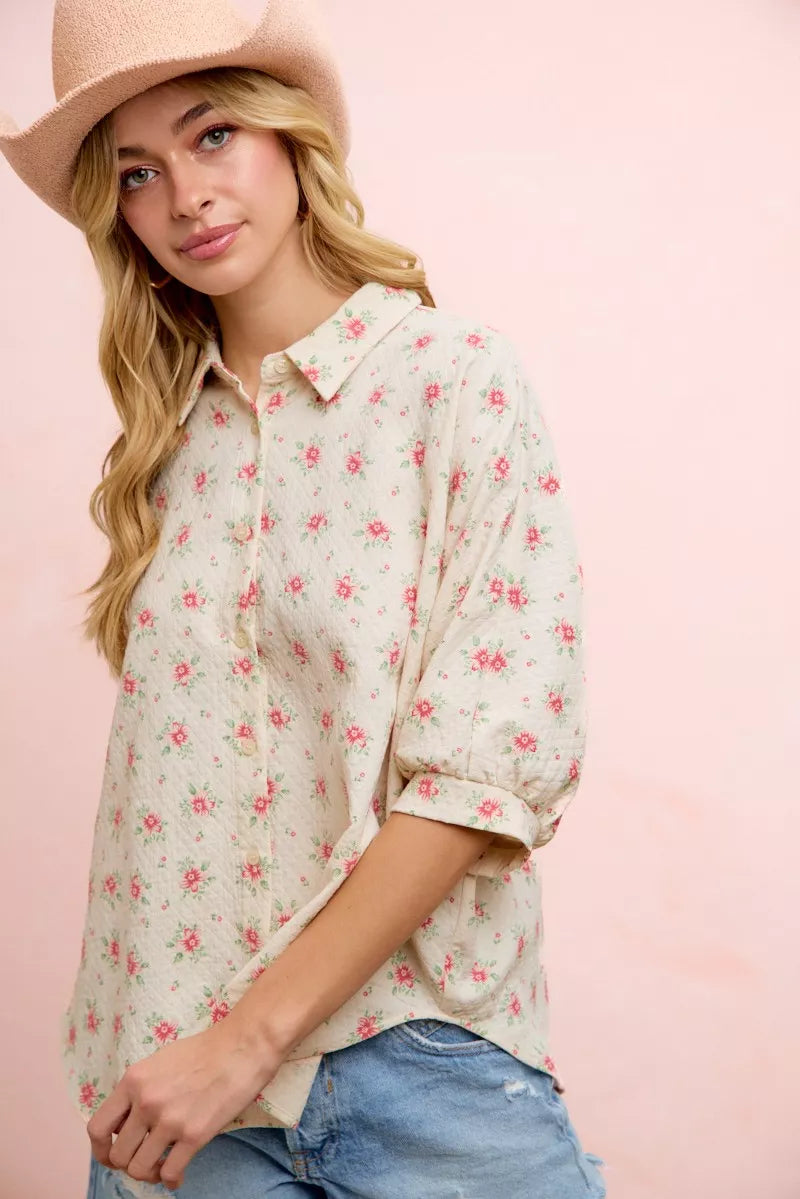 Red floral printed short dolman blouse top by Trendsi featuring a flowy, relaxed fit and vibrant flower design.