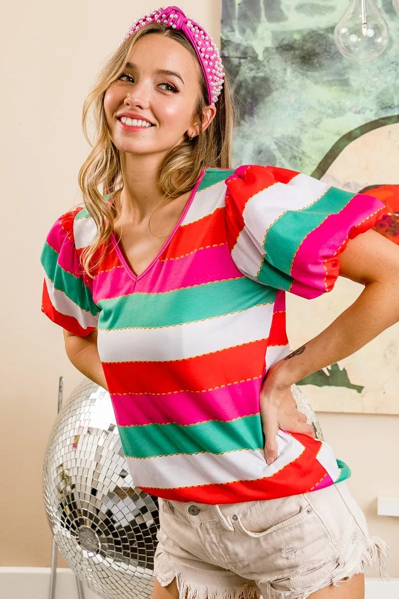Red, fuchsia, and green multi-stripe print V-neck top with puff sleeves from Trendsi featuring a stylish, colorful design.